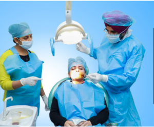 Dr. Sunny Singh Ahluwalia performing dental implant surgery at Japjee Family Dental Clinic in Mohali.